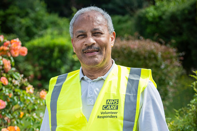 Community Response Volunteer Irving wearing a NHS and Care Volunteer Responder hiviz jacket