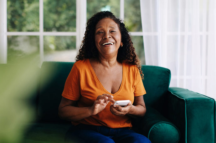 A woman on her phone texting 