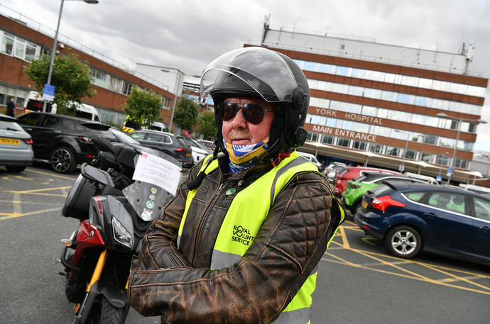 A Pick Up and Deliver volunteer getting ready for a pick up outside York Hospital 